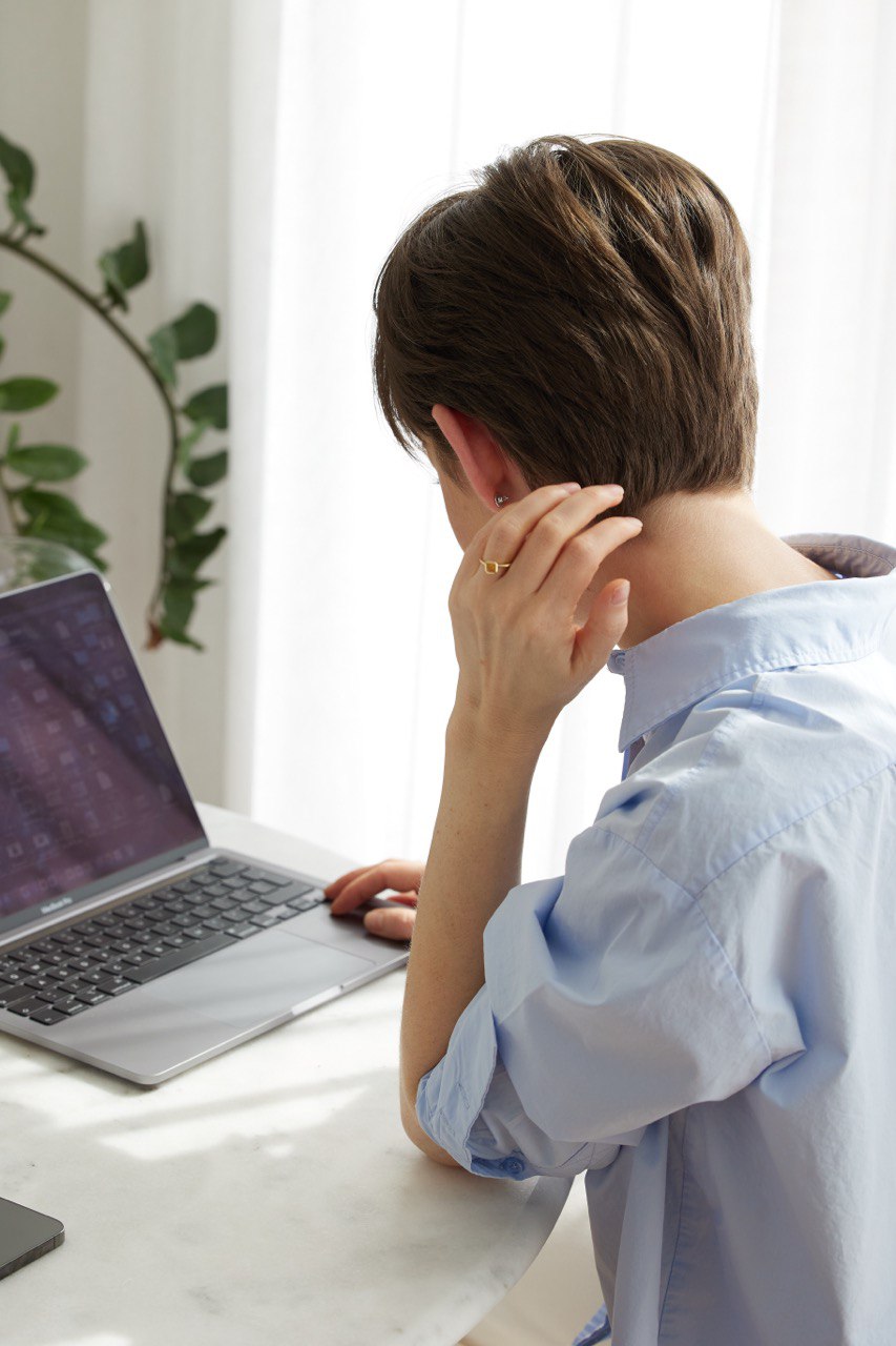 a woman watching in a laptop
