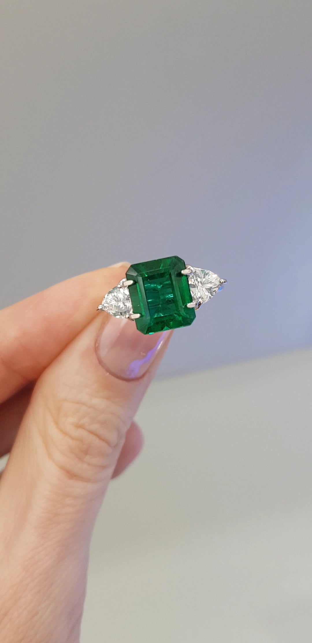 a ring with a green gemstone