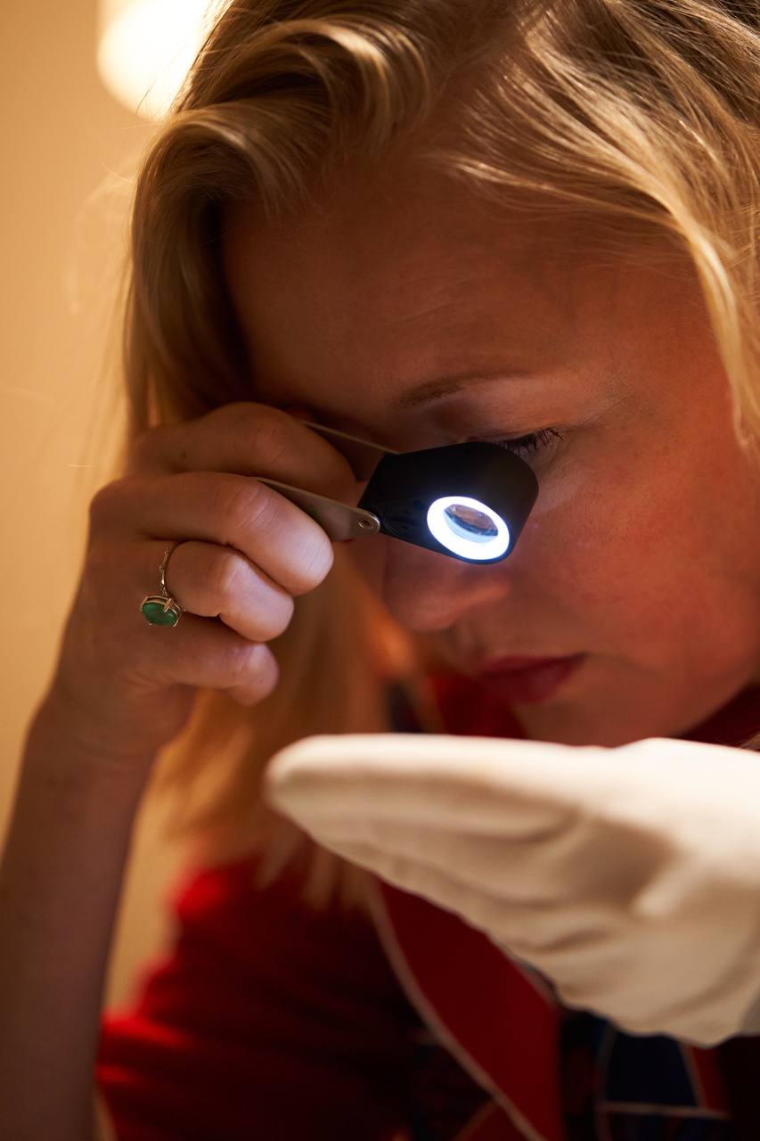 a woman watching in a magnifying glass