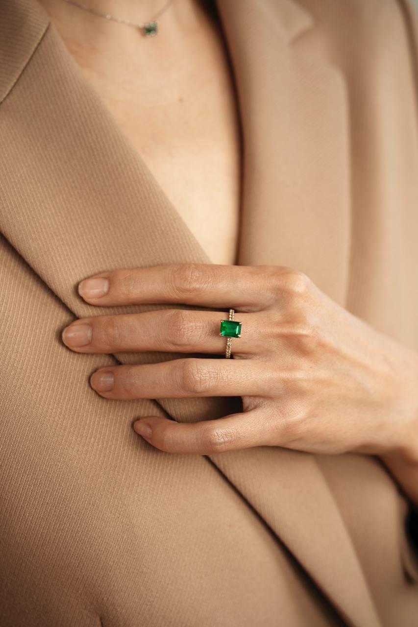 a ring with a green gemstone