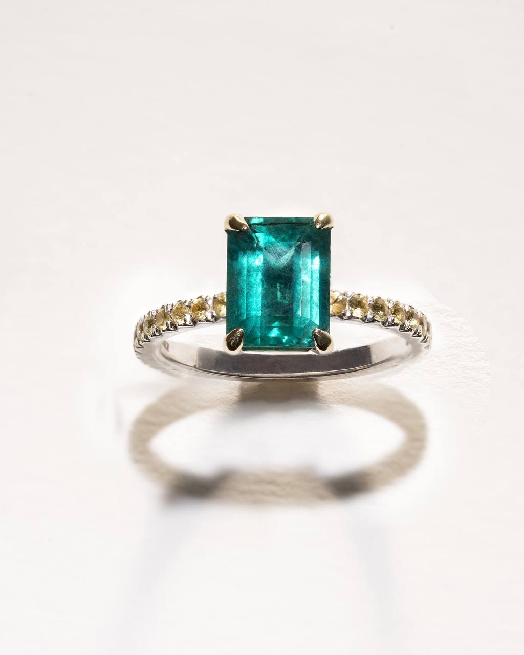 a ring with a green gemstone