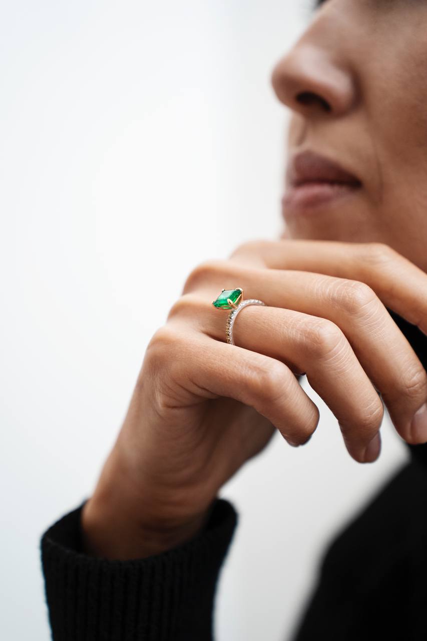 a ring with a green gemstone