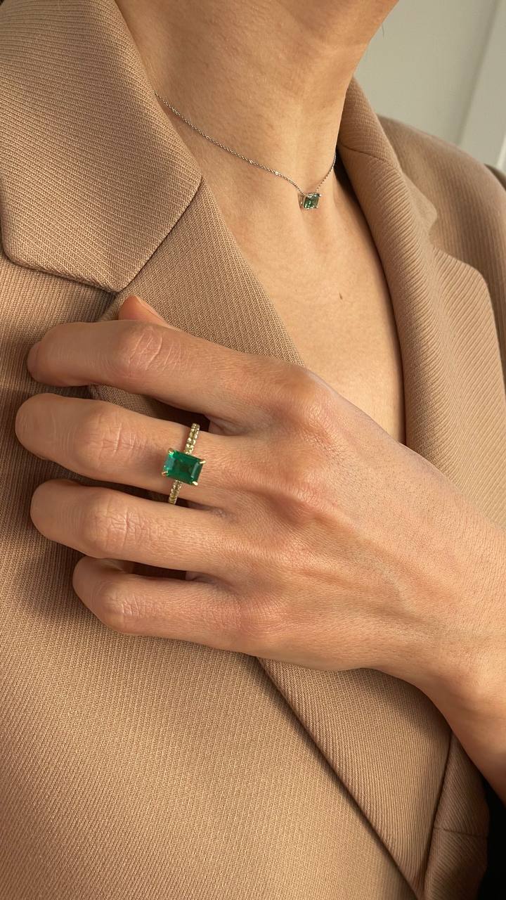 a ring with a green gemstone