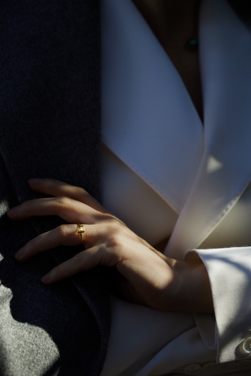 a ring with a yellow gemstone