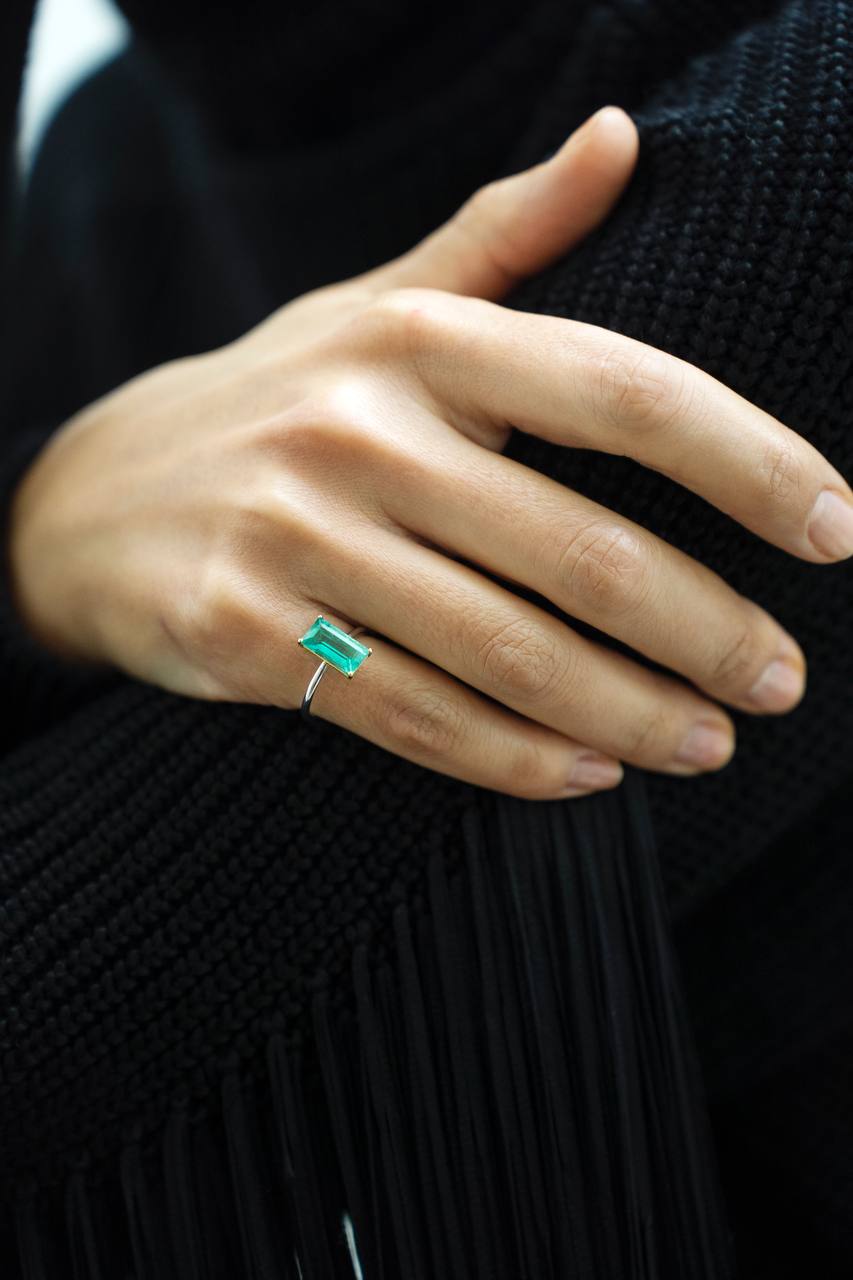 a ring with green gemstone